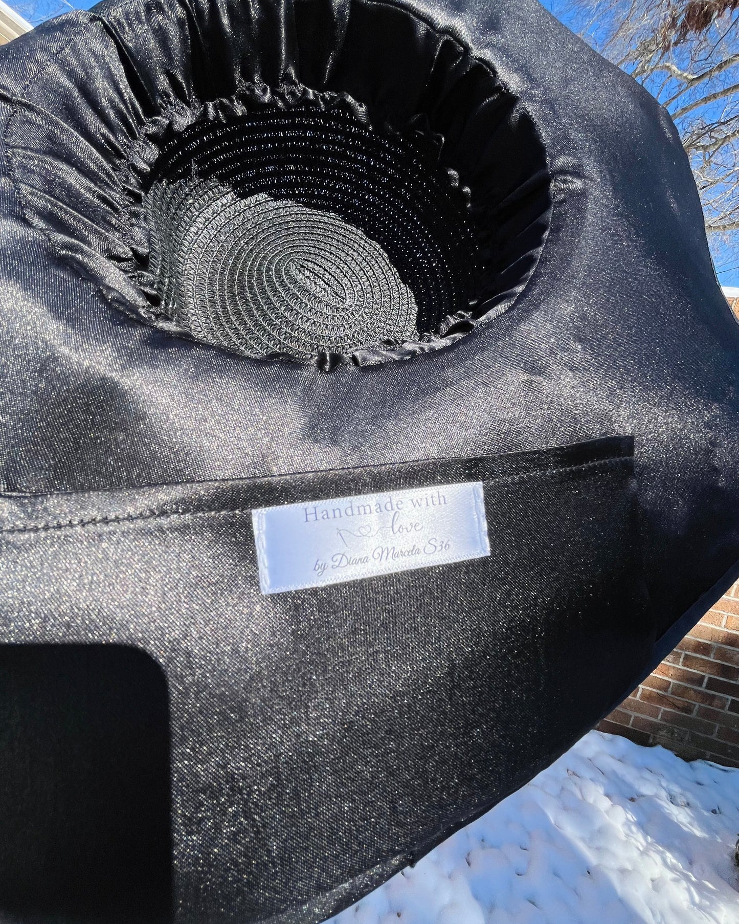 Satin lined interior with hidden pocket inside Manifest Hat, photographed in winter snow